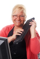 mature woman plays the keyboard